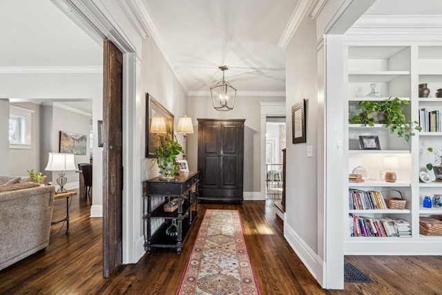 72 Miami Ave, Columbus, OH 43203 - entryway featuring dark wood-style floors, a notable chandelier, crown molding, and baseboards