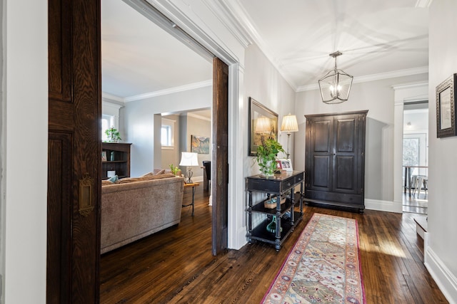 72 Miami Ave, Columbus, OH 43203 - entrance foyer with baseboards, ornamental molding, dark wood-type flooring, and a chandelier