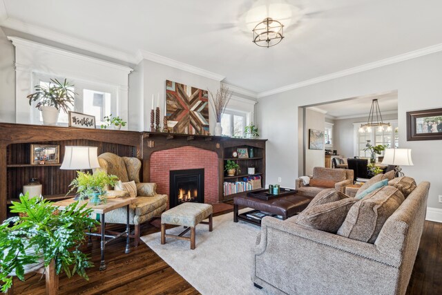 72 Miami Ave, Columbus, OH 43203 - living area with a chandelier, ornamental molding, a fireplace, and wood finished floors