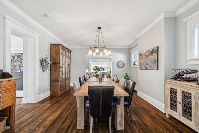 72 Miami Ave, Columbus, OH 43203 - dining room featuring baseboards, a chandelier, crown molding, and dark wood finished floors