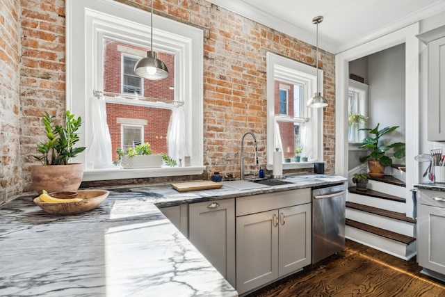 72 Miami Ave, Columbus, OH 43203 - kitchen with dishwasher, dark wood-style flooring, a sink, and brick wall