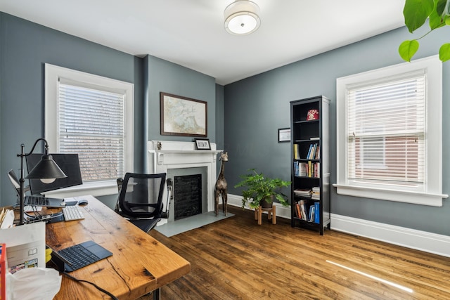 72 Miami Ave, Columbus, OH 43203 - office space featuring a fireplace with flush hearth, baseboards, and wood finished floors