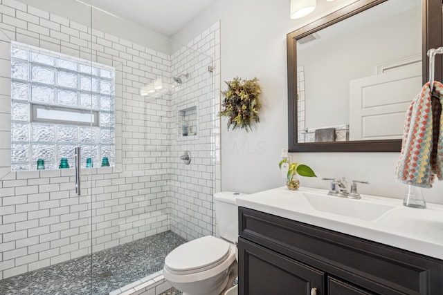 72 Miami Ave, Columbus, OH 43203 - full bathroom with toilet, a tile shower, and vanity