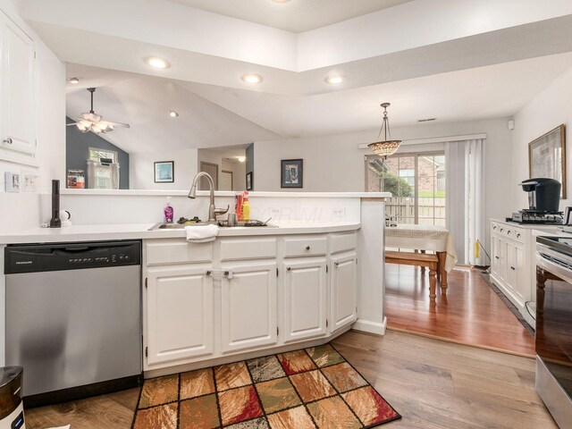 kitchen featuring a sink, light countertops, stainless steel dishwasher, and white cabinetry