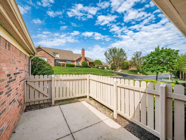 view of patio featuring fence