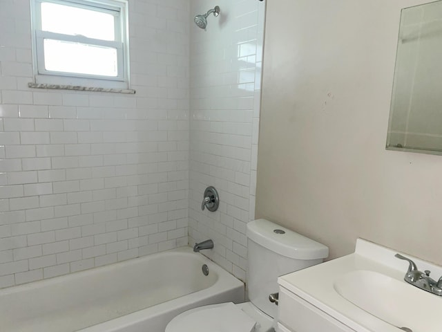 bathroom with shower / tub combination, toilet, and vanity