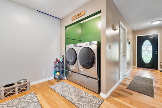 51 Township Rd Unit 1357, South Point, OH 45680 - washroom with a textured ceiling, washing machine and dryer, wood finished floors, and baseboards