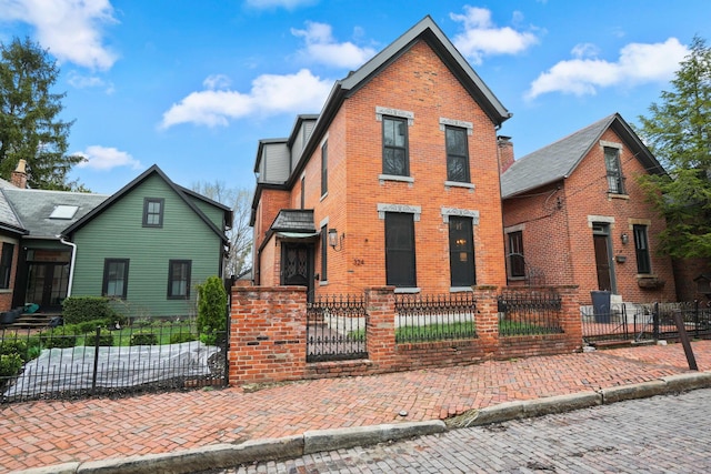 324 Jackson St, Columbus, OH 43206 - view of front of property with a fenced front yard and brick siding