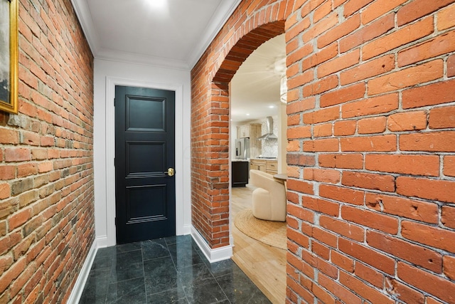 324 Jackson St, Columbus, OH 43206 - interior space with baseboards, ornamental molding, and brick wall