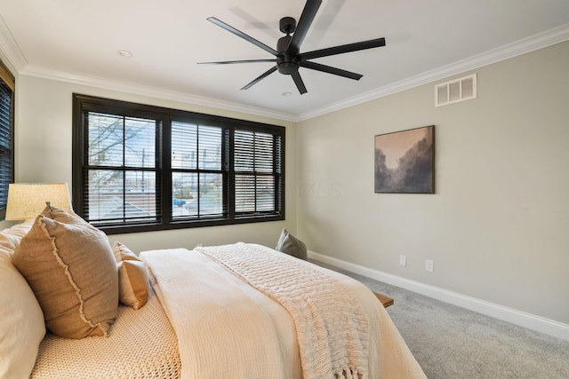 324 Jackson St, Columbus, OH 43206 - carpeted bedroom with a ceiling fan, crown molding, baseboards, and visible vents