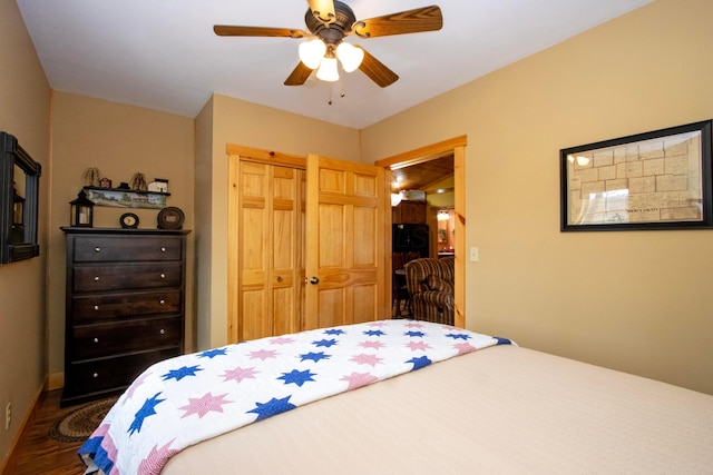 bedroom featuring a closet, ceiling fan, and wood finished floors