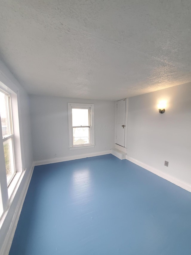 1273-1275 E 18th Ave, Columbus, OH 43211 - empty room with baseboards and a textured ceiling