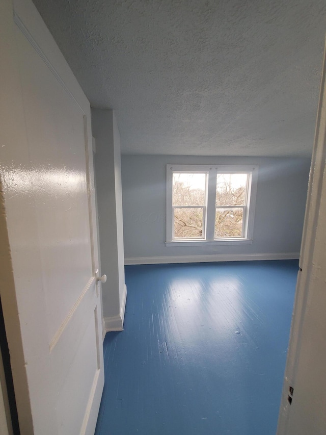 1273-1275 E 18th Ave, Columbus, OH 43211 - spare room featuring a textured ceiling and baseboards