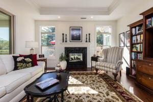 5165 Bluffton Way, Delaware, OH 43015 - interior space with ornamental molding, a glass covered fireplace, wood finished floors, recessed lighting, and a raised ceiling