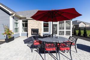 5165 Bluffton Way, Delaware, OH 43015 - view of patio with an outdoor fireplace, fence, and outdoor dining space