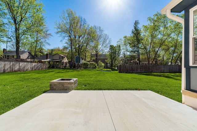 view of patio featuring fence and an outdoor fire pit