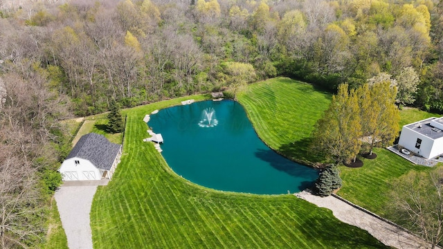 bird's eye view featuring a view of trees and a water view