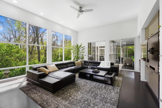 sunroom with wood finished floors and recessed lighting