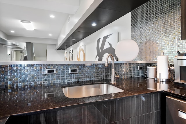 kitchen with open shelves, stainless steel dishwasher, a sink, and tasteful backsplash