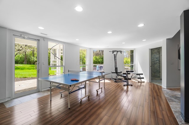 recreation room with visible vents, wood finished floors, and recessed lighting