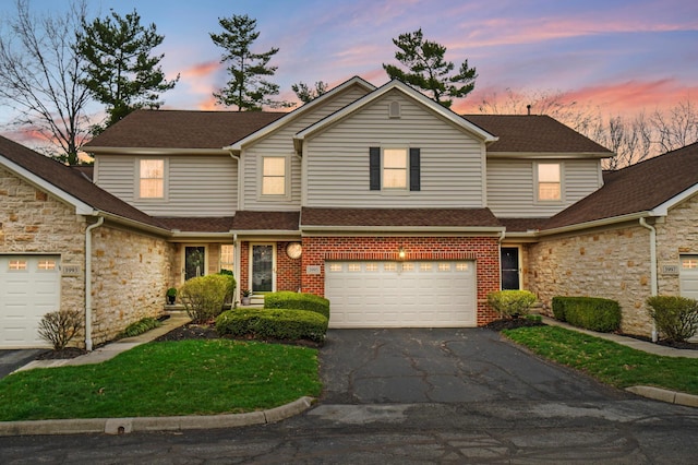 3995 Kensingwood Dr, Columbus, OH 43230 - traditional-style house featuring an attached garage and aphalt driveway