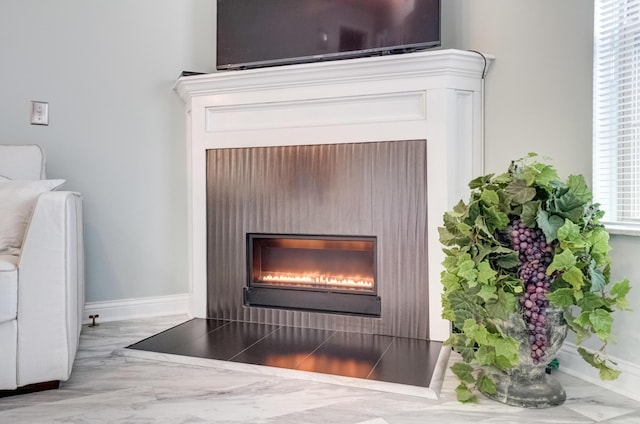 3995 Kensingwood Dr, Columbus, OH 43230 - details with baseboards and a warm lit fireplace