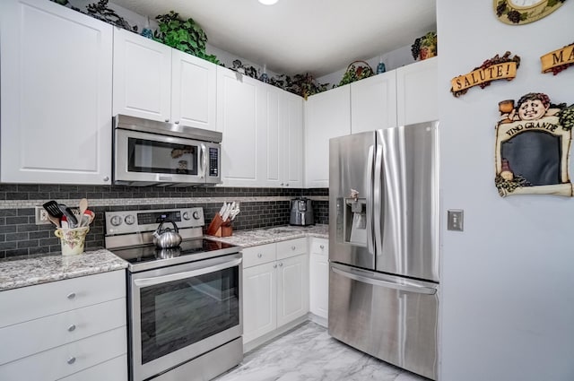 3995 Kensingwood Dr, Columbus, OH 43230 - kitchen with backsplash, marble finish floor, stainless steel appliances, and white cabinets