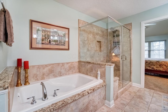3995 Kensingwood Dr, Columbus, OH 43230 - ensuite bathroom featuring a bath, a stall shower, ensuite bath, and a textured ceiling