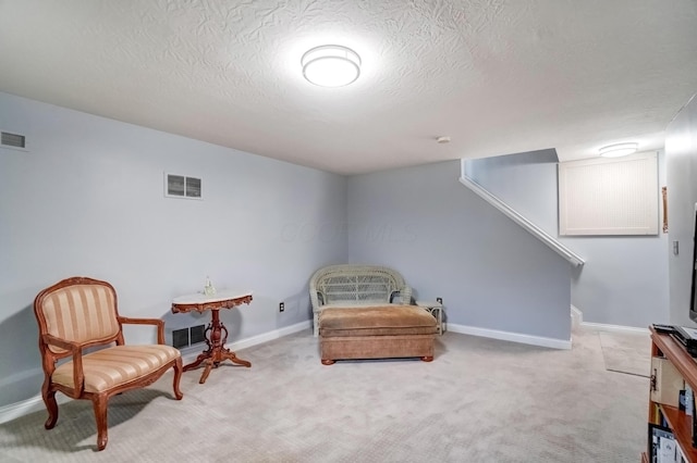 3995 Kensingwood Dr, Columbus, OH 43230 - living area featuring stairs, visible vents, baseboards, and carpet