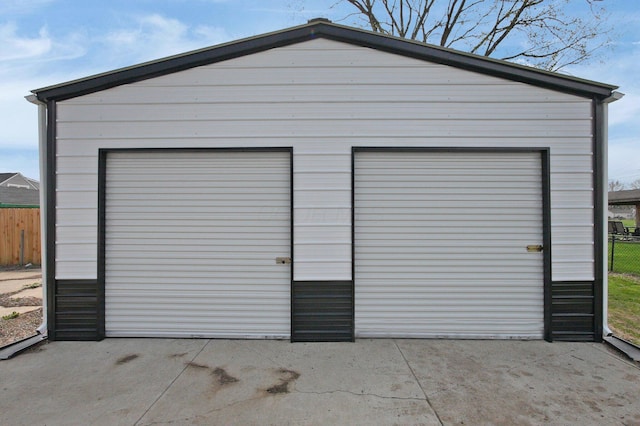 detached garage with fence