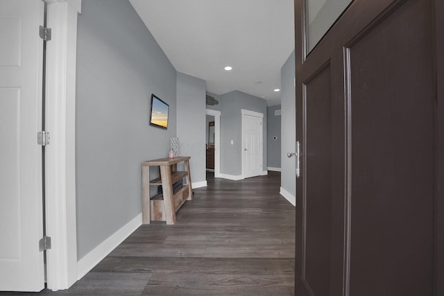 corridor featuring recessed lighting, baseboards, and dark wood-style flooring