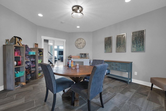 dining space with baseboards and recessed lighting
