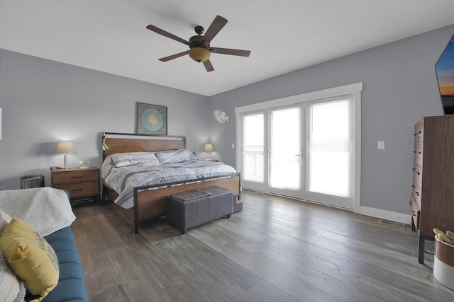 bedroom featuring wood finished floors, ceiling fan, and access to outside