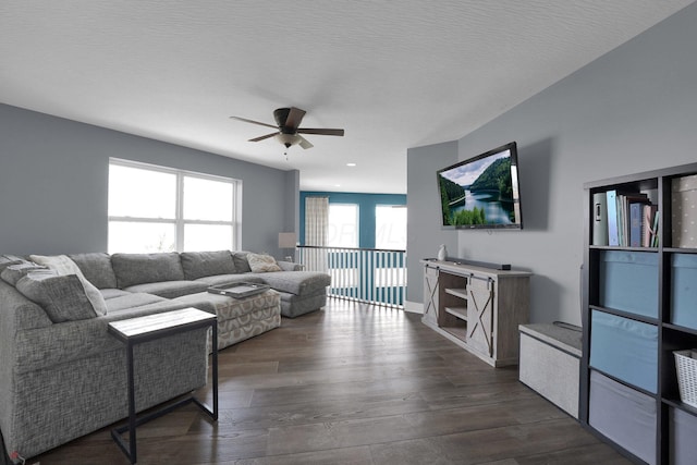 living area featuring dark wood finished floors, a ceiling fan, and recessed lighting