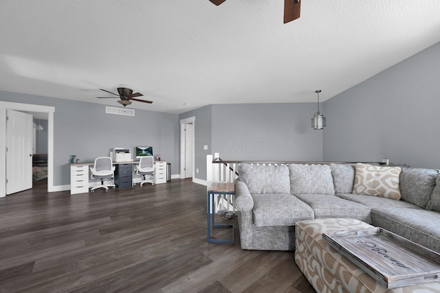 living room with dark wood finished floors, baseboards, a ceiling fan, and visible vents