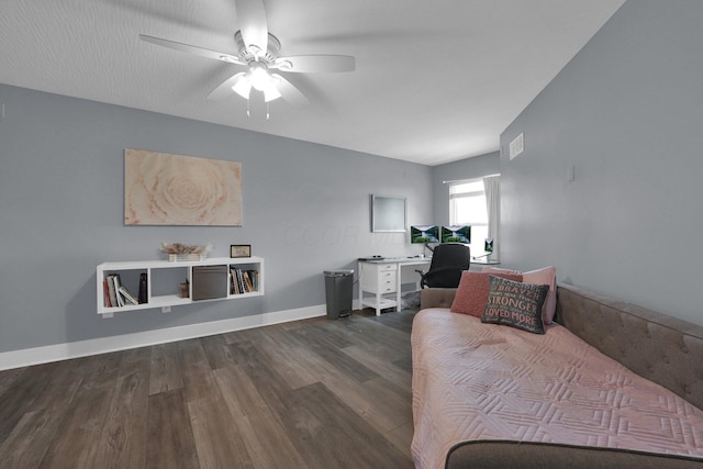 office area with baseboards, a ceiling fan, visible vents, and dark wood finished floors