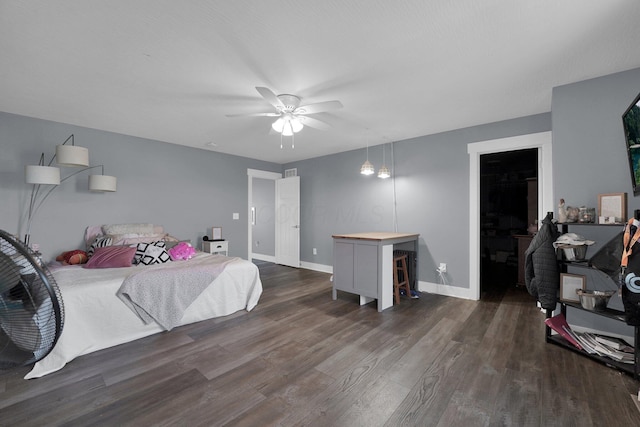 bedroom featuring a ceiling fan, baseboards, dark wood-style flooring, and visible vents
