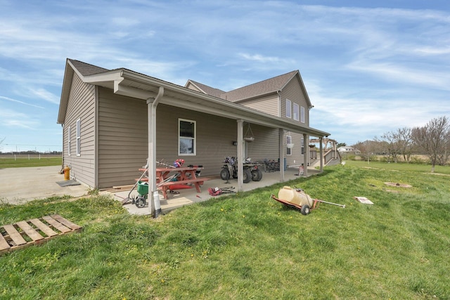 view of property exterior featuring a yard and a patio
