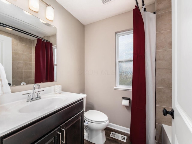 bathroom with a shower with curtain, a wealth of natural light, visible vents, and toilet