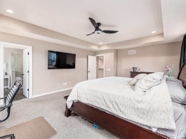 bedroom featuring carpet flooring, a raised ceiling, baseboards, visible vents, and recessed lighting
