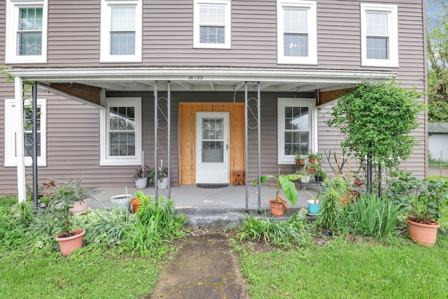 doorway to property featuring a porch