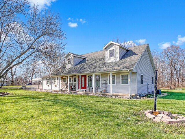 2837 State Route 529, Cardington, OH 43315 - new england style home featuring a shingled roof, a front yard, and covered porch
