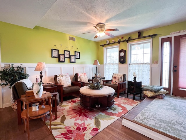 2837 State Route 529, Cardington, OH 43315 - sitting room featuring a wainscoted wall, a textured ceiling, visible vents, a ceiling fan, and wood finished floors
