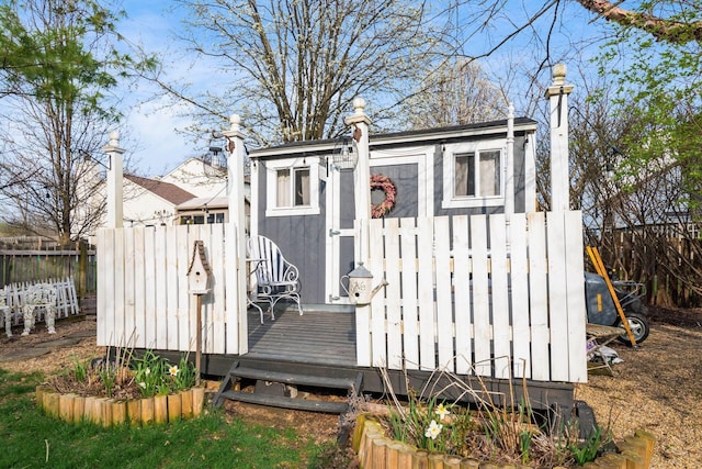 view of outbuilding with an outbuilding and fence