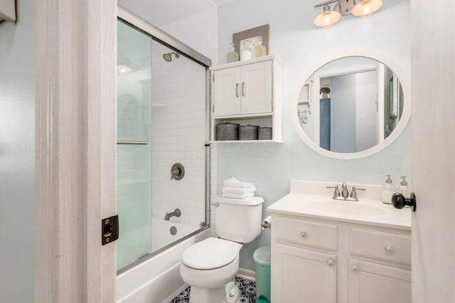 full bathroom with combined bath / shower with glass door, vanity, and toilet