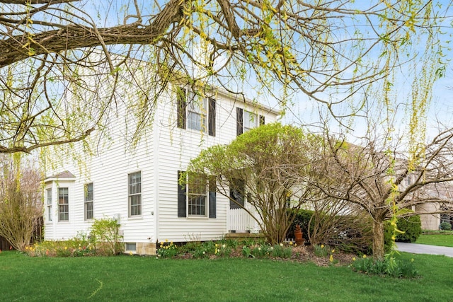 view of property exterior featuring a yard
