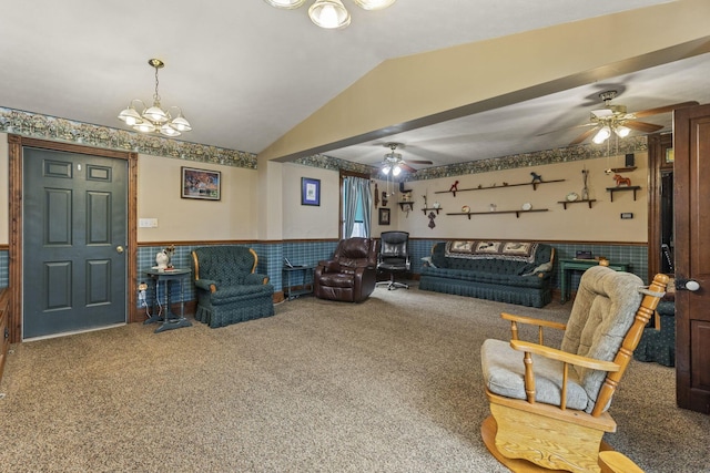 living room with ceiling fan with notable chandelier, wainscoting, lofted ceiling, and carpet floors