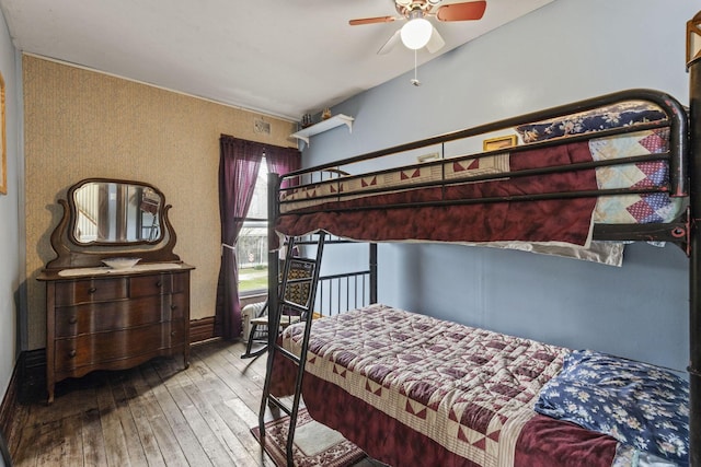 bedroom featuring a ceiling fan and hardwood / wood-style flooring