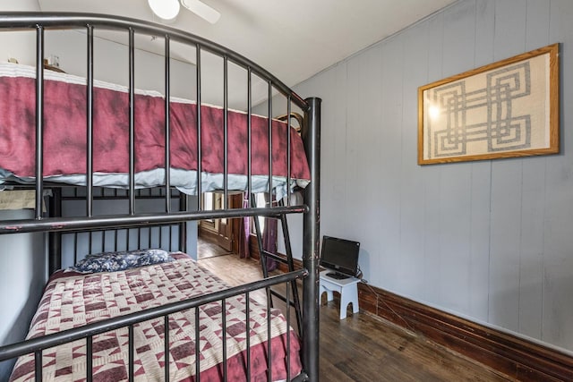 bedroom featuring dark wood finished floors
