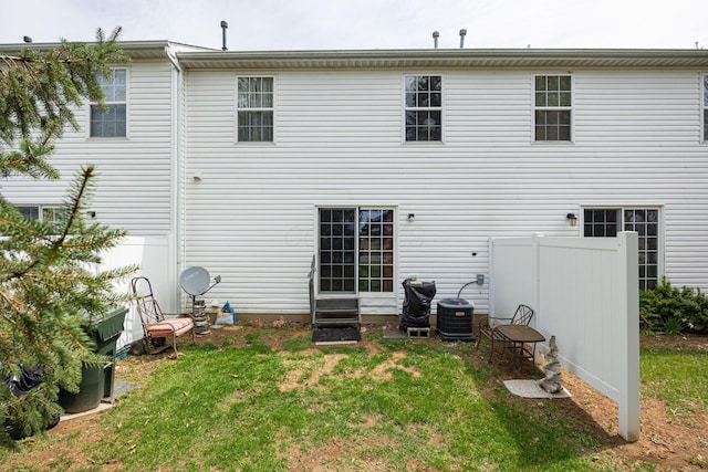 4859 Brice Pond Dr Unit 19B, Canal Winchester, OH 43110 - rear view of house with entry steps, a lawn, and central air condition unit